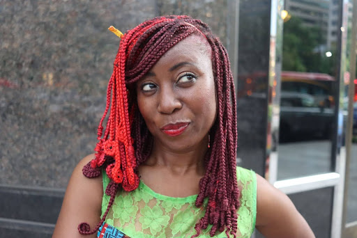 Tolu "TolumiDE" Yeboah in front of Carlyle Room in Washington, D.C., on May 23 (Eden Harris/The Washington Informer)