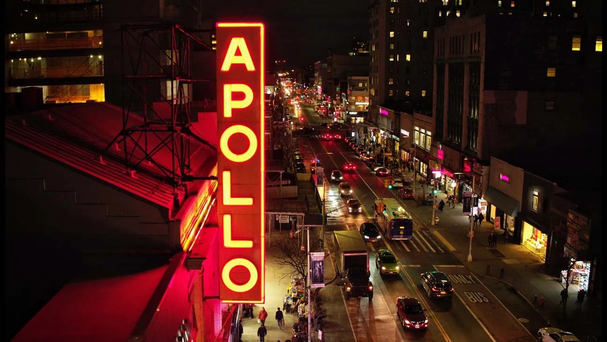 The famed Apollo Theater's neon sign shines over 125th Street in New York's Harlem neighborhood. (Courtesy of HBO via AFI Docs Film Festival)