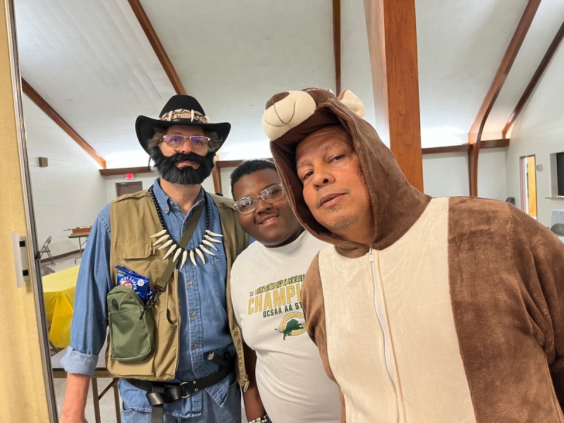 Tom Liebrand dressed as “Crocodile Dundee,” Isaiah Harris, who played Jesus, and Ken Roberts, who played “Bounce,” the kangaroo. (Hamil R. Harris/The Washington Informer)