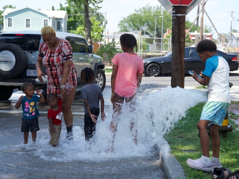 **FILE** A mother and her children cool off on a hot day in 2023. While June 2023 was originally record-breaking, June 2024 surpassed those numbers, becoming the hottest June on record. (WI photo)