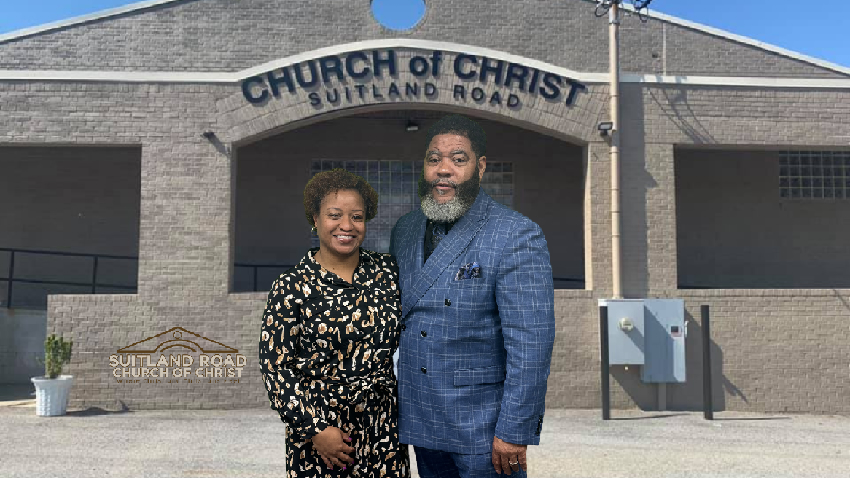 Minister Deon Booker (right) and his wife Sophia Booker pose in front of Suitland Road Church of Christ. (Courtesy photo)
