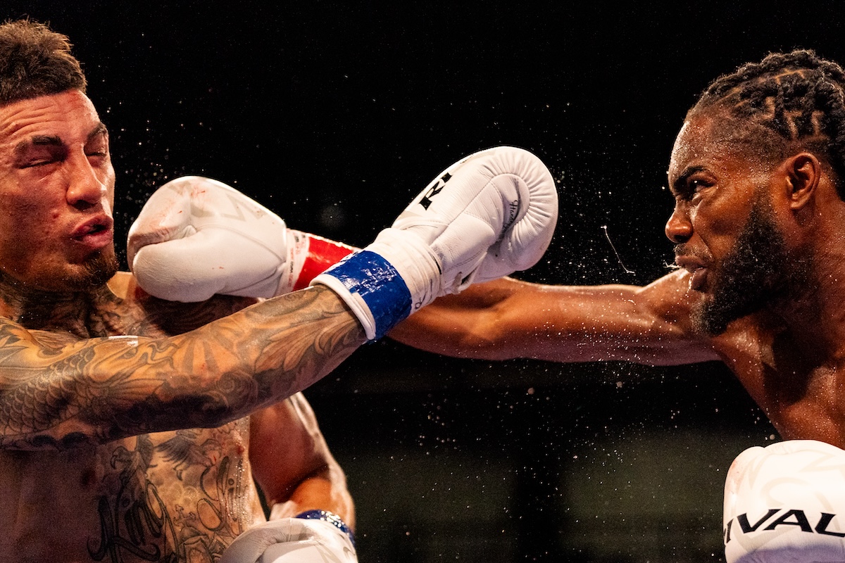 Winner Jordan White (right) and Jason Sanchez throw punches at each other during the title fight held at the Entertainment and Sports Arena in Washington, D.C., on Aug. 3. (Marcus Relacion/The Washington Informer)