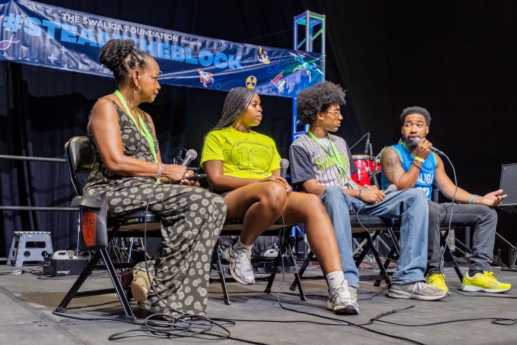 Washington Informer Publisher Denise Rolark Barnes (left) moderates a conversation about STEAM with Asreil Thomas, Amari Washington and Lemond “MR. IMAG” Brown, founder and CEO of the Swaliga Foundation. (Ja’Mon Jackson/The Washington Informer)
