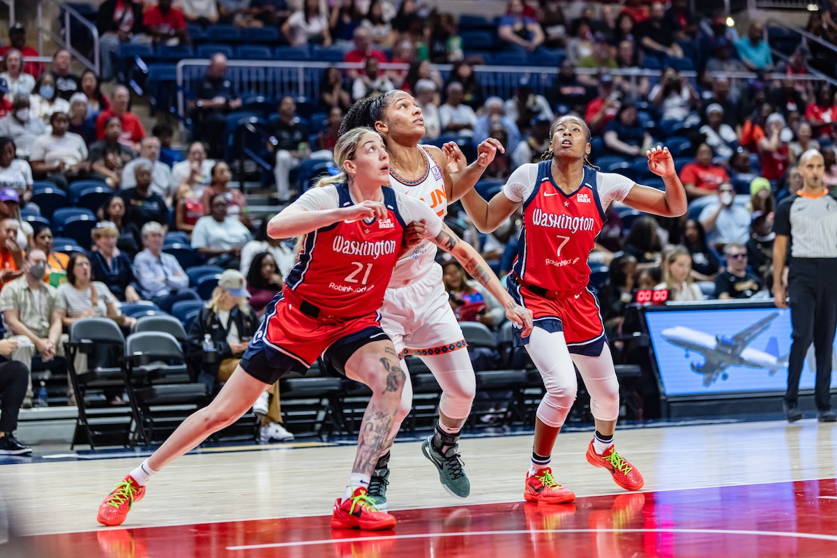 **FILE** Washington Mystics Emily Engster and Ariel Atkins in a game against the Connecticut Sun. Since the close of the 2024 Summer Olympics, the Washington Mystics are continuing the last half of their season with hopes to improve their record with the return of key players. (Jonae Guest/The Washington Informer)