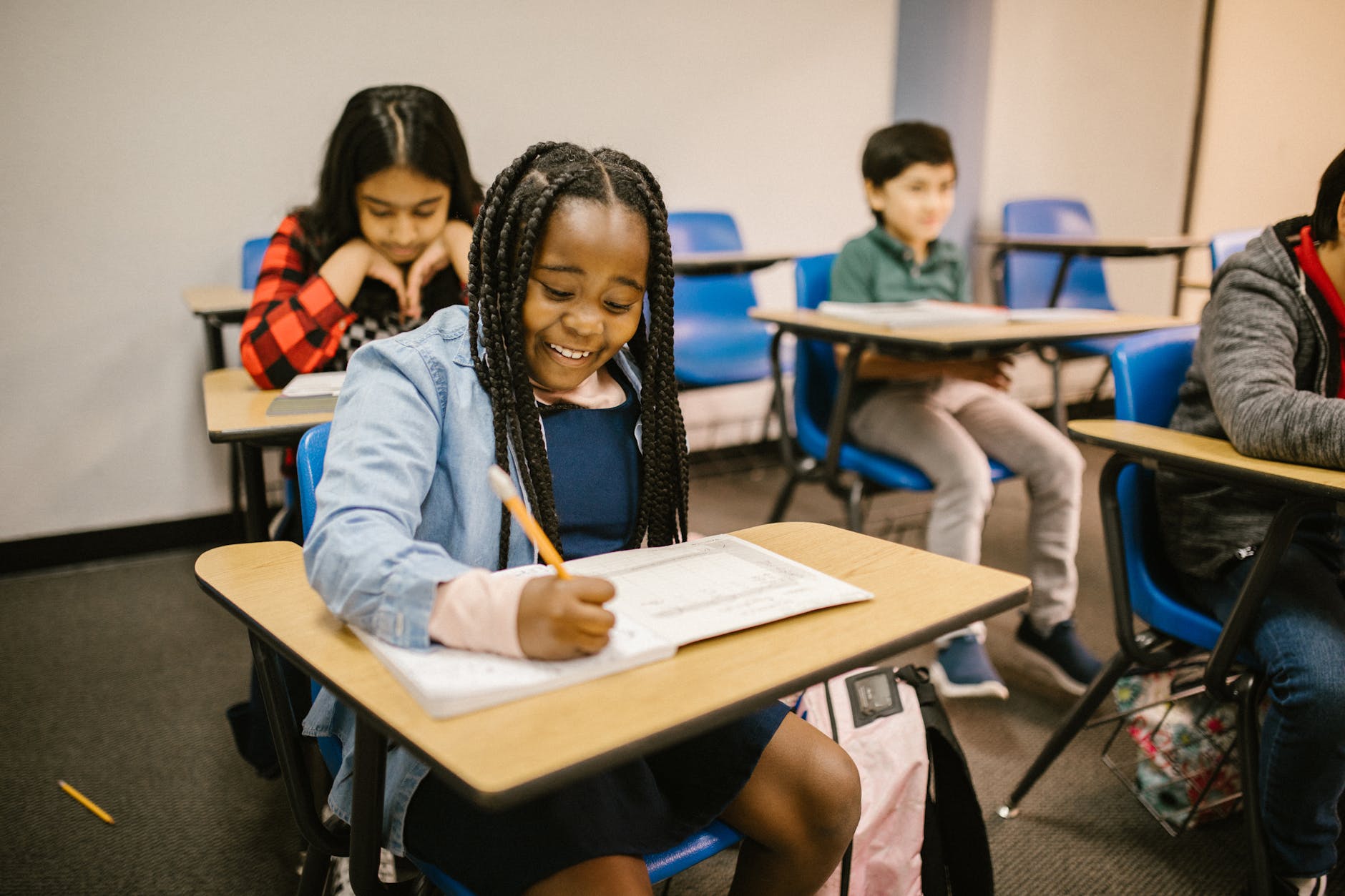 girl laughing while writing